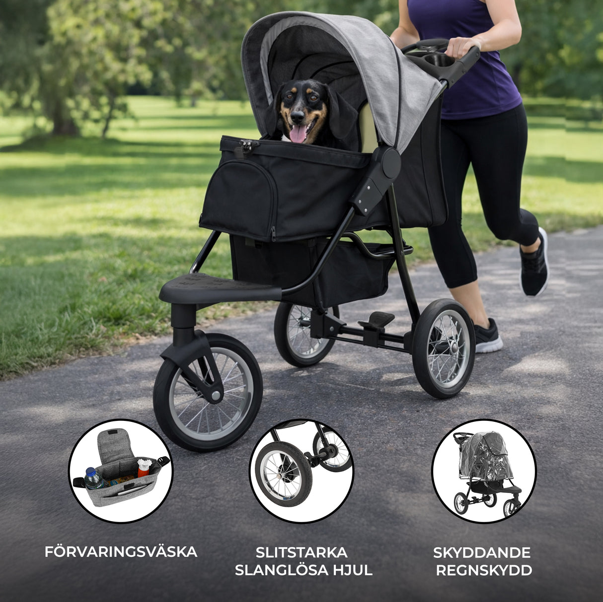 Grå husdjursvagn med en hund i selen, stora slanglösa hjul och ett skyddande regnskydd, perfekt för promenader i parken