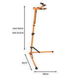 Cykelreparationsställ i orange metall med justerbar höjd, stabila ben och hållare för cykelram, perfekt för reparationer
