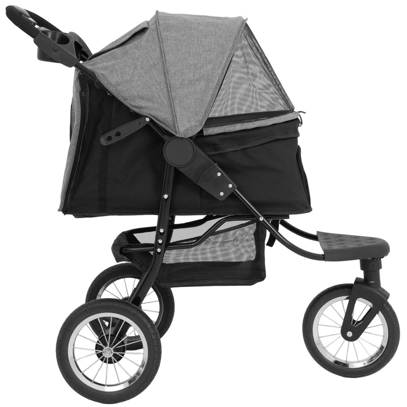 Grå och svart barnvagn med en stor, skyddande sufflett och robusta hjul, perfekt för promenader och utflykter med små barn