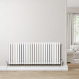 Oval enkelpelarradiator i vit färg, 600 x 1440 mm, med släta ytor och stilren design, placerad mot en ljus vägg i ett modernt rum