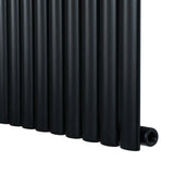 Oval enkelpelarradiator i svart, 1600 x 480 mm, med släta, cylindriska rör och en modern, stilren design som passar i alla rum